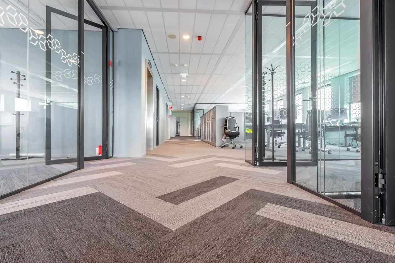 Commercial carpet in an office corridor in Seattle, WA, where traffic concentrates in a narrow walking path