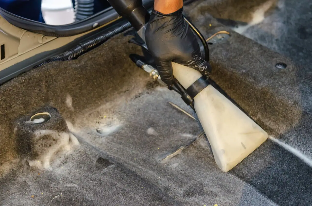 Hot water extraction wand in use during a carpet cleaning job in Seattle, WA